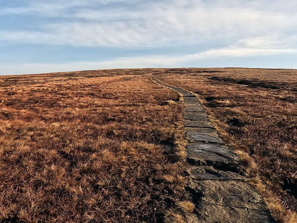 Flagged path heading to summit of Pendle Hill