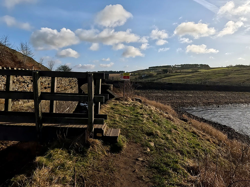 Footbridge back onto the road at Lower Ogden Reservoir