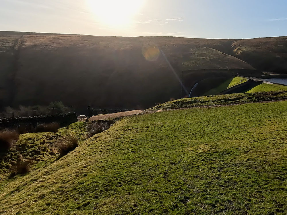 Heading down beside the wall to Upper Ogden Reservoir