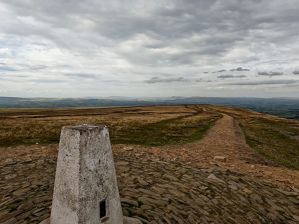 Looking towards the Yorkshire Three Peaks from the trig point on Pendle Hill
