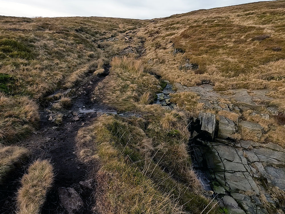 Pendle Way path heading up Boar Clough pulls in beside the stream