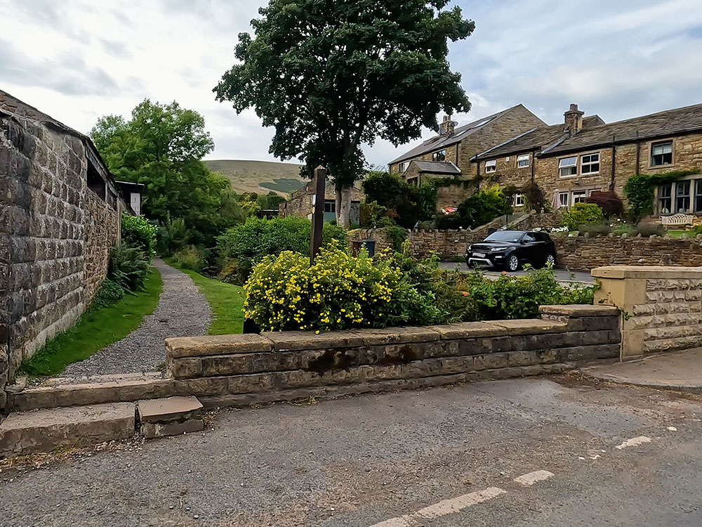 Footpath to Pendle Hill leaving the road in Barley