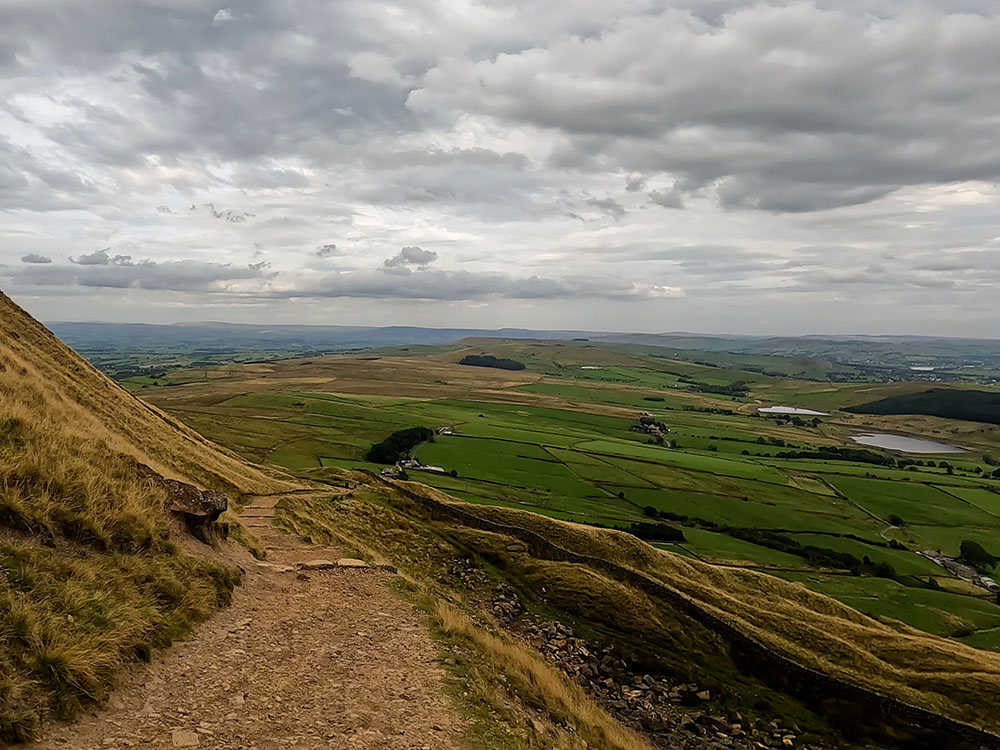 Heading down the slope across the front of Pendle Hill