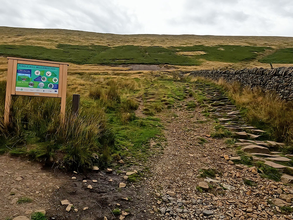 Information board by the start of the steps heading up Pendle Hill