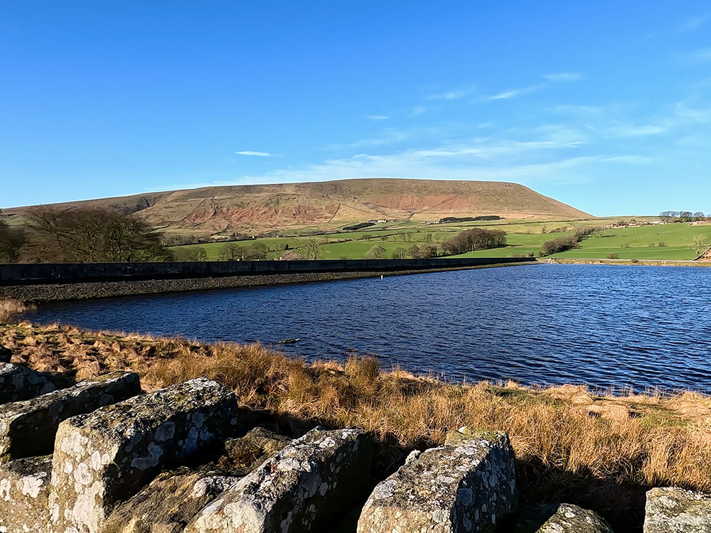 Looking back across Lower Black Moss Reservoir towards Pendle Hill