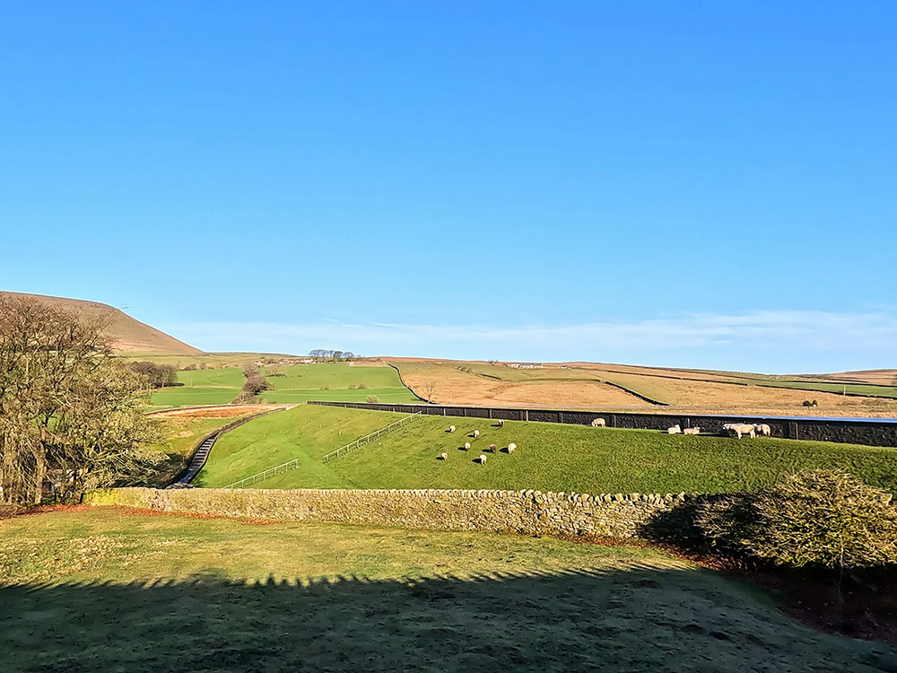 Pendle Hill and dam for Lower Black Moss Reservoir