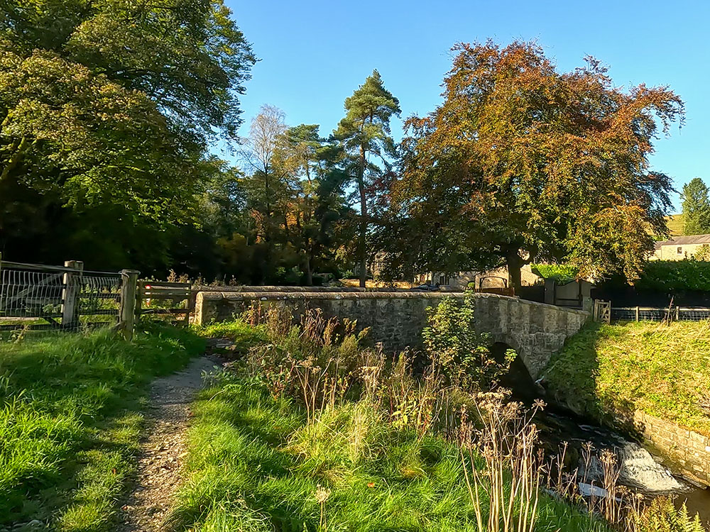 Approaching the bridge over Pendle Water, where we turn left