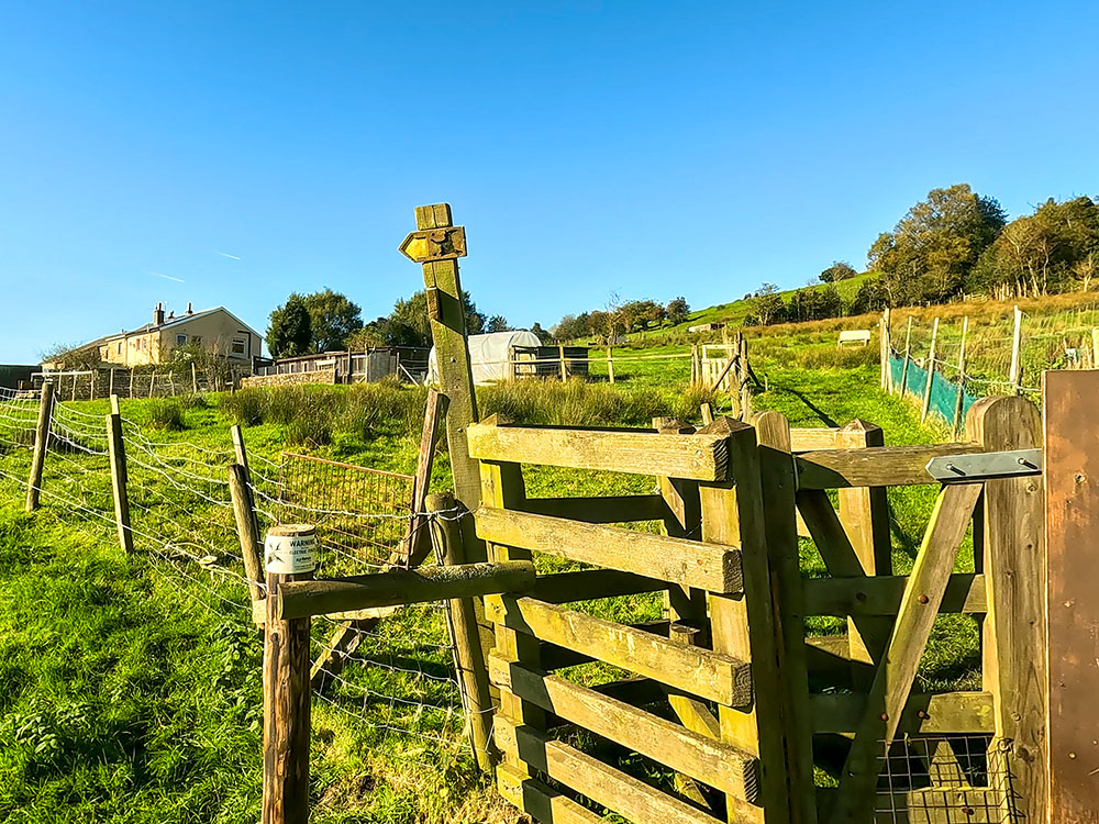 The footpath sign at the end of the fenced section