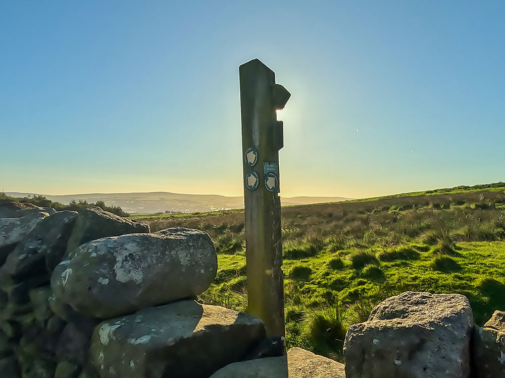 Crossing over the wall and meeting up with the Pendle Way