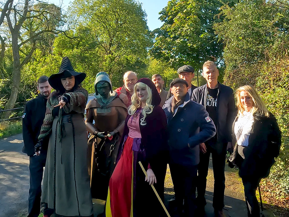 Some of the 'Peaky Blinders' on a witches sightseeing tour by the Alice Nutter statue in Roughlee