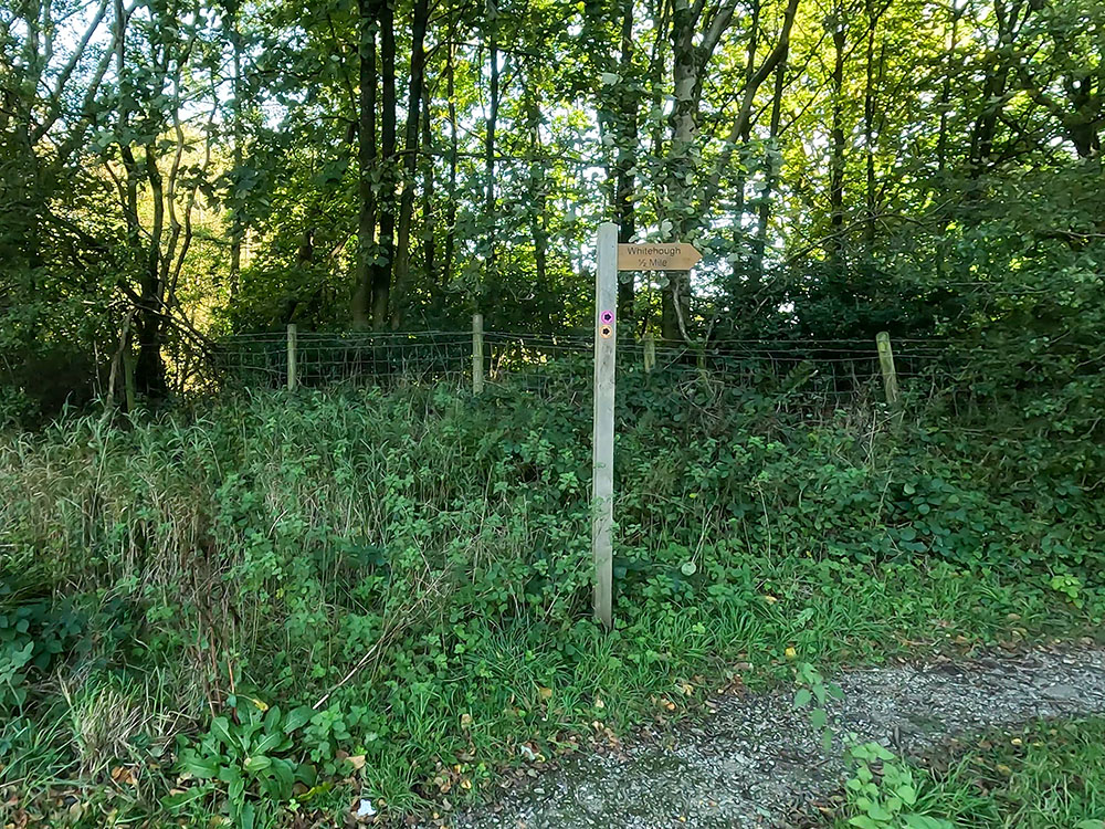 Whitehough footpath sign in the corner of the car park at Barley