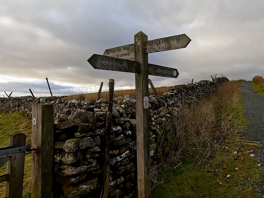 4-way signpost at path junction with Horton Scar Lane