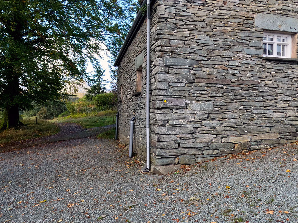 Footpath down the side of the last building at Park Farm