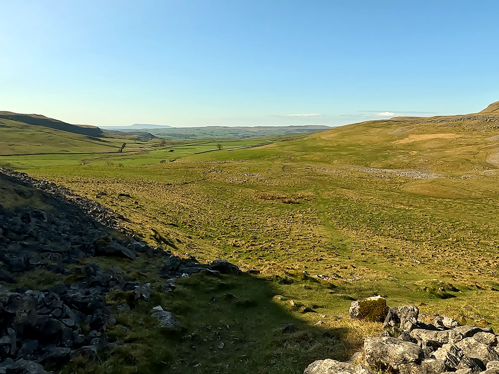 Looking down Crummack Dale with Pendle Hill on the horizon