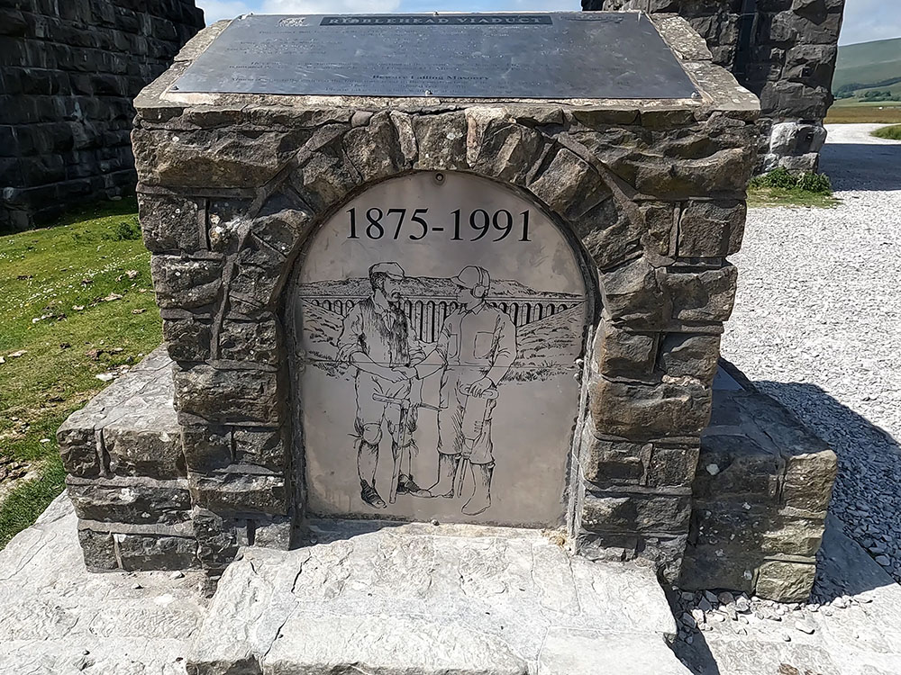 Monument in front of the Ribblehead Viaduct