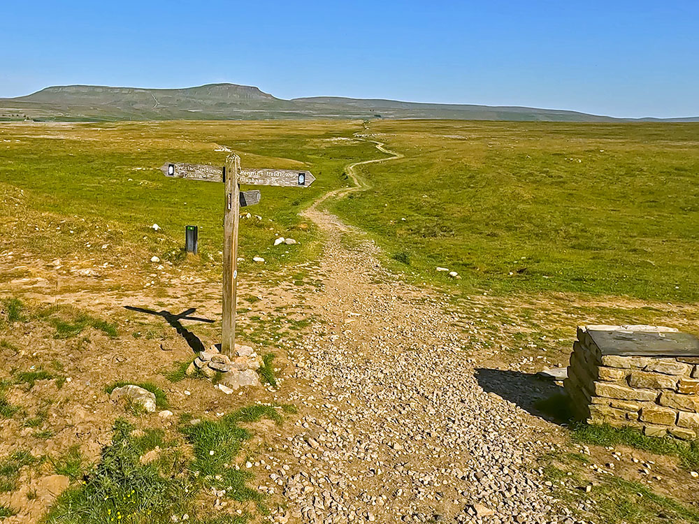 Yorkshire 3 Peak's path continues straight ahead at the signpost