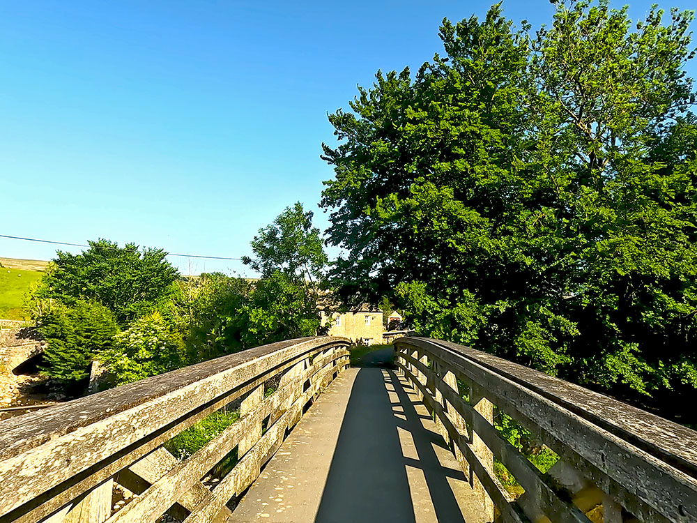 Heading over the wooden bridge over the River Ribble