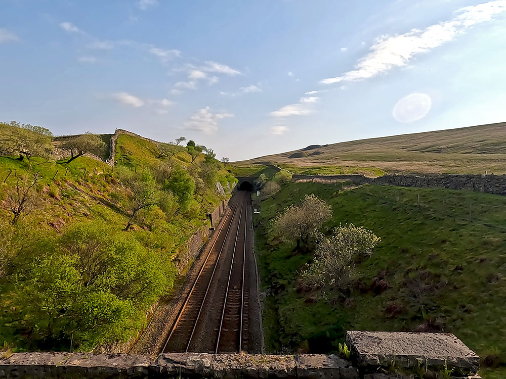 Looking along the Settle to Carlisle railway line towards the air shafts from the aqueduct