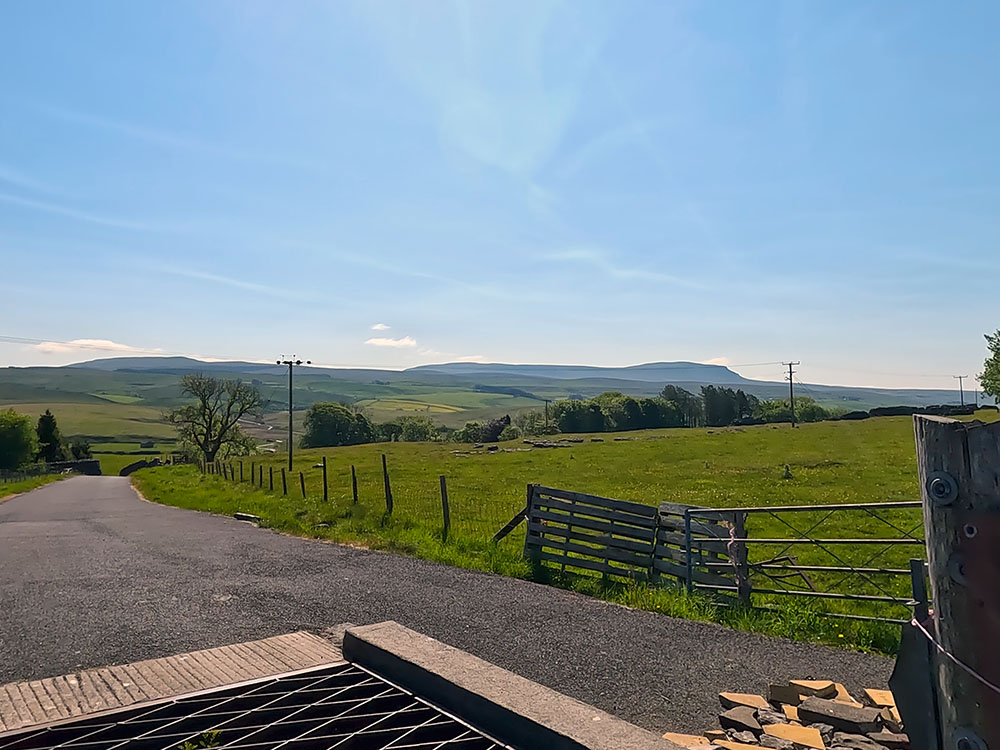 Looking back at Pen-y-ghent from the cattle grid where the 3 Peaks path meets the B6479 road towards Ribblehead