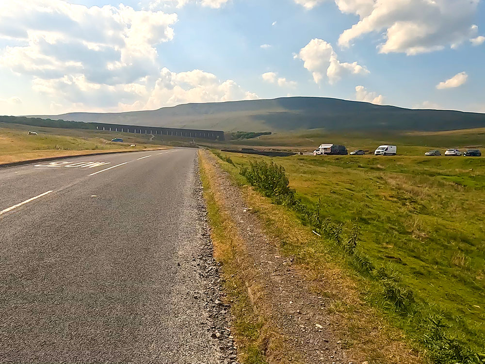 Path beside the road heading towards the Ribblehead Viaduct