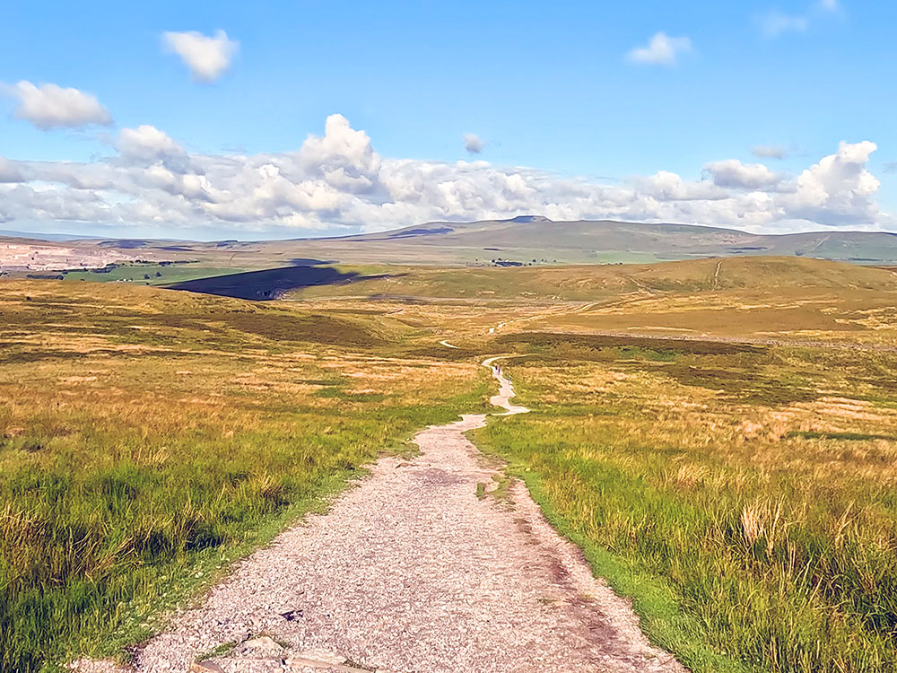 Pennine Way path heading down from Pen-y-ghent summit