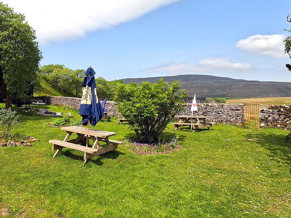 The Station Inn beer garden looking towards Whernside and the Ribblehead Viaduct