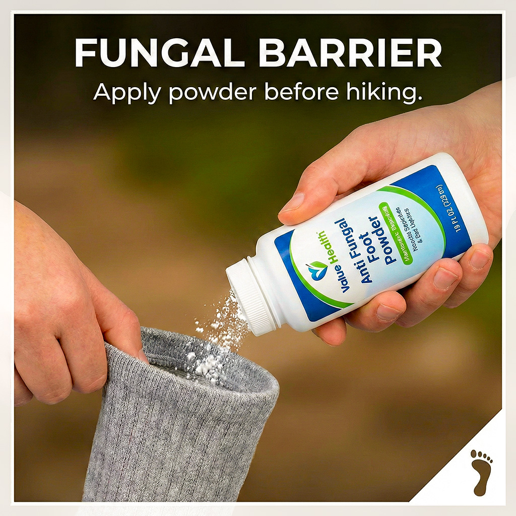 Applying antifungal powder to prevent athlete's foot in high-moisture boots.