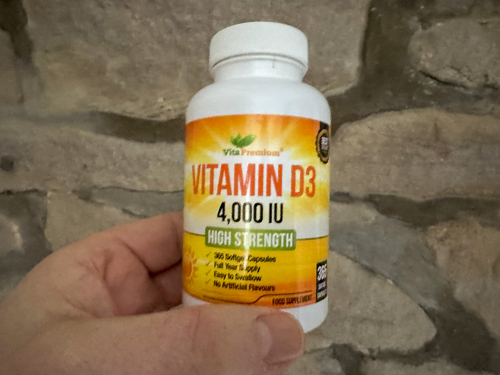 Bottle of high-strength vitamin D3 4000 IU softgel capsules showing the upper-limit adult daily dose supplement commonly used in the UK for vitamin D support